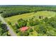 Aerial view showcasing a house and surrounding farm land at 2491 Highway 274 Hwy, Cherryville, NC 28021