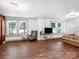 Comfortable bedroom with hardwood floors, large windows, and a TV stand at 2491 Highway 274 Hwy, Cherryville, NC 28021