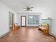 Bright living room with hardwood floors, ceiling fan, and wood benches at 2491 Highway 274 Hwy, Cherryville, NC 28021