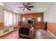 Living room with hardwood floors, ceiling fan, and wood-paneled walls at 2491 Highway 274 Hwy, Cherryville, NC 28021