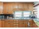 Kitchen boasts ample wood cabinets and a double sink at 2491 Highway 274 Hwy, Cherryville, NC 28021