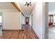 Long hallway with hardwood floors and exposed beams leading to other rooms at 2491 Highway 274 Hwy, Cherryville, NC 28021