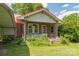 Brick house with red metal roof, front porch, and landscaping at 2491 Highway 274 Hwy, Cherryville, NC 28021
