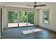 Main bedroom with sliding doors to deck and wood-look floors at 416 Plantation Way, Mount Gilead, NC 27306