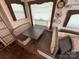 Built-in dinette with gray cushioned bench seating at 332 Mount View Ln, New London, NC 28127
