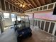 Golf cart is parked inside this spacious garage at 332 Mount View Ln, New London, NC 28127