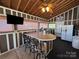 Open floor plan with bar, seating, and a large screen TV at 332 Mount View Ln, New London, NC 28127