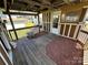 Spacious covered deck with stone flooring, perfect for relaxing outdoors at 332 Mount View Ln, New London, NC 28127