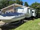 RV, boat, and storage building on a grassy lot at 332 Mount View Ln, New London, NC 28127
