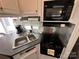 Small galley kitchen with microwave and cooktop at 332 Mount View Ln, New London, NC 28127