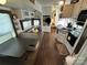 Open living area with kitchen, dining, and sitting areas at 332 Mount View Ln, New London, NC 28127