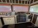 Stainless steel grill and ample counter space highlight this outdoor kitchen at 332 Mount View Ln, New London, NC 28127
