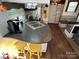 Kitchen with sink, counter space, and two bar stools at 332 Mount View Ln, New London, NC 28127
