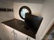 Vanity with TV and mirror above cabinets at 332 Mount View Ln, New London, NC 28127
