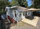 Exterior of the house showcasing the side and patio at 108 Meadowview Cir, New London, NC 28127