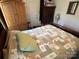 Cozy bedroom with a double bed, dresser, and armoire at 108 Meadowview Cir, New London, NC 28127