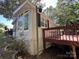 House exterior showcasing the side and deck at 108 Meadowview Cir, New London, NC 28127