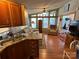 Open kitchen with wood floors and island at 108 Meadowview Cir, New London, NC 28127