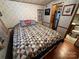 Charming bedroom with a full-size bed and partial bathroom view at 108 Meadowview Cir, New London, NC 28127
