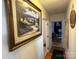 Hallway with framed artwork and access to bedrooms at 108 Meadowview Cir, New London, NC 28127