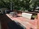 Deck with outdoor furniture and storage bin at 108 Meadowview Cir, New London, NC 28127