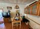 Bright dining area with wood flooring, a table and chairs, and built-in cabinets at 108 Meadowview Cir, New London, NC 28127