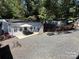 Exterior view showing the house and neighboring properties at 108 Meadowview Cir, New London, NC 28127