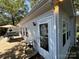 Exterior view of the house with a patio and landscaping at 108 Meadowview Cir, New London, NC 28127