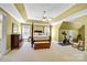 Spacious bedroom with high ceiling, carpeted floor, and a post bed at 5610 Golden Pond Dr, Indian Trail, NC 28079