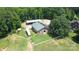 Aerial view of property with barn, shed, and surrounding land at 5610 Golden Pond Dr, Indian Trail, NC 28079
