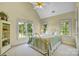 Bright bedroom with a metal bed frame and large windows at 5610 Golden Pond Dr, Indian Trail, NC 28079