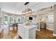 Open kitchen features a large island and breakfast area with views to Gathering room at 5610 Golden Pond Dr, Indian Trail, NC 28079