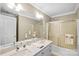 Bathroom with a double sink and shower/tub combo at 5610 Golden Pond Dr, Indian Trail, NC 28079