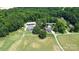 Aerial view of house, pool, and expansive grounds at 5610 Golden Pond Dr, Indian Trail, NC 28079