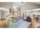 Open living room with hardwood floors and views of the kitchen and staircase at 5610 Golden Pond Dr, Indian Trail, NC 28079