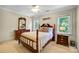 Cozy bedroom with a wooden bed frame and ample natural light at 5610 Golden Pond Dr, Indian Trail, NC 28079