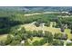 Aerial view of house, expansive property, and surrounding landscape at 5610 Golden Pond Dr, Indian Trail, NC 28079