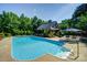 Inviting pool with a pergola and lounge chairs at 5610 Golden Pond Dr, Indian Trail, NC 28079