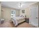 Cozy bedroom with carpeted floors and a window looking outside at 5610 Golden Pond Dr, Indian Trail, NC 28079