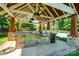 Stone outdoor kitchen with stainless steel appliances and sink at 5610 Golden Pond Dr, Indian Trail, NC 28079