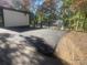 Asphalt parking area with protective wheel stops at 144 Hickory Hollow Ln, Taylorsville, NC 28681
