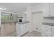 Kitchen with breakfast bar, view of living room, and access to dining area at 144 Hickory Hollow Ln, Taylorsville, NC 28681