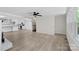 Living room with hardwood floors, kitchen access and staircase at 144 Hickory Hollow Ln, Taylorsville, NC 28681