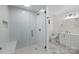 Modern bathroom with a large shower, white vanity, and marble flooring at 144 Hickory Hollow Ln, Taylorsville, NC 28681