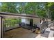 Lakefront house exterior with a covered porch and deck at 144 Hickory Hollow Ln, Taylorsville, NC 28681