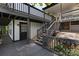 Home features a deck with stairs leading down to a lower level and a stone retaining wall at 144 Hickory Hollow Ln, Taylorsville, NC 28681