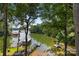 Lakefront view with private docks and lush greenery at 144 Hickory Hollow Ln, Taylorsville, NC 28681
