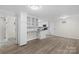 Open concept dining area with kitchen and access to bathroom at 144 Hickory Hollow Ln, Taylorsville, NC 28681
