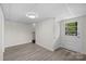 Finished basement room with exterior access and vinyl flooring at 144 Hickory Hollow Ln, Taylorsville, NC 28681