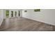 Large main bedroom with hardwood floors and access to balcony at 144 Hickory Hollow Ln, Taylorsville, NC 28681